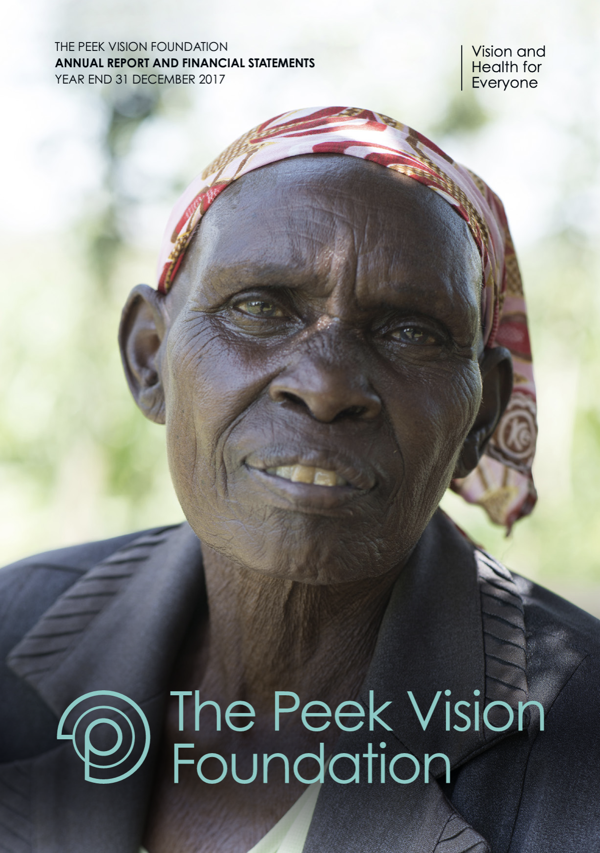 An elderly woman in Africa smiles for the camera. In front of the photo it reads Peek Vision Foundation, Annual Report 2017.