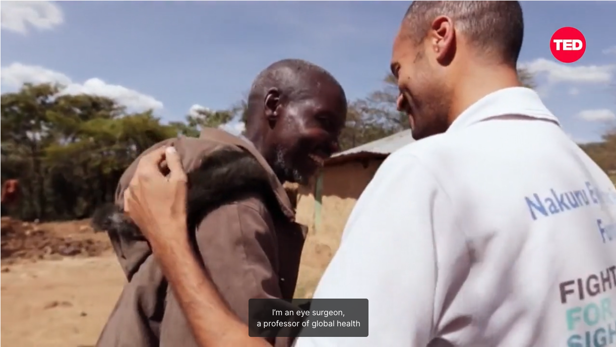 Still from the film linked to showing Andrew Bastawrous agreeing a patient in Kenya