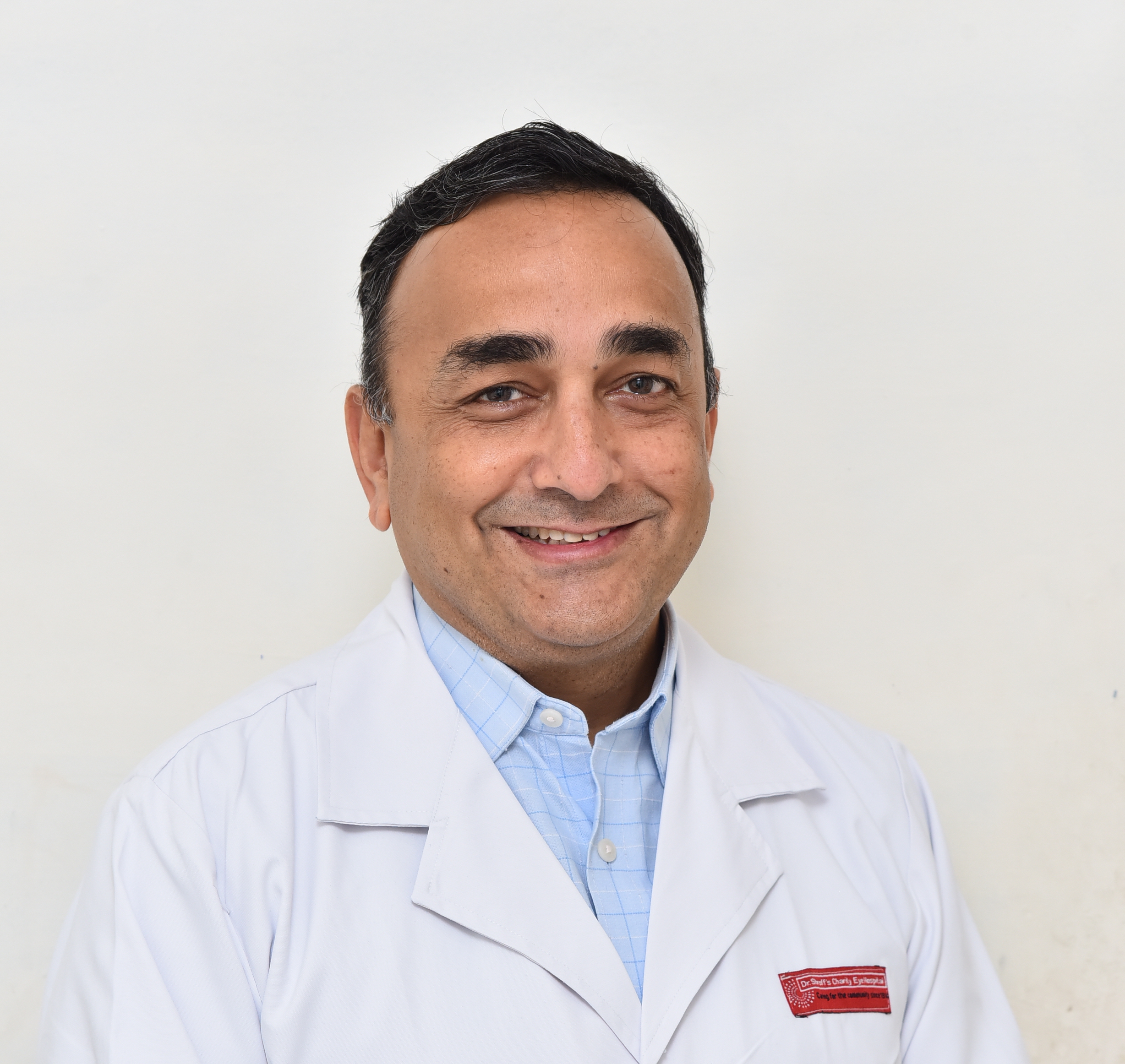Portrait photo of Dr Umang Mathur